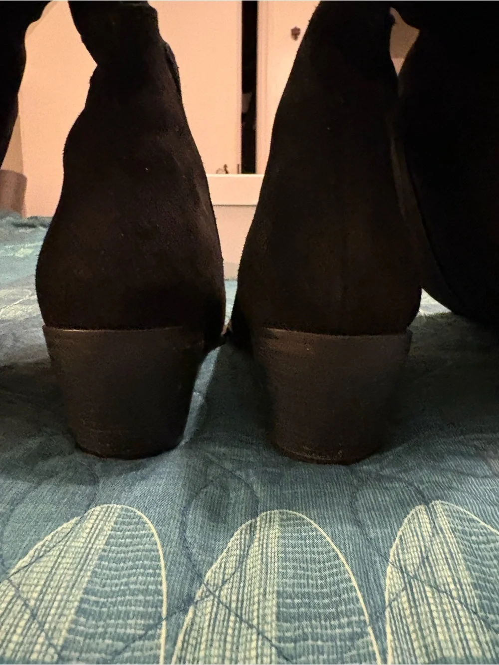 Black suede boots. Nothing more. Nothing less. Over the knee.